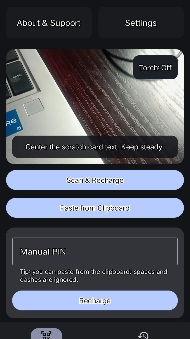 ScanTopUp home screen with the camera viewfinder, torch switch, Scan & Recharge, Paste from Clipboard and Manual PIN options.